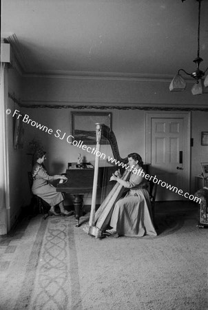 MRS AND EILEEN MC CABE PLAYING HARP AND PIANO